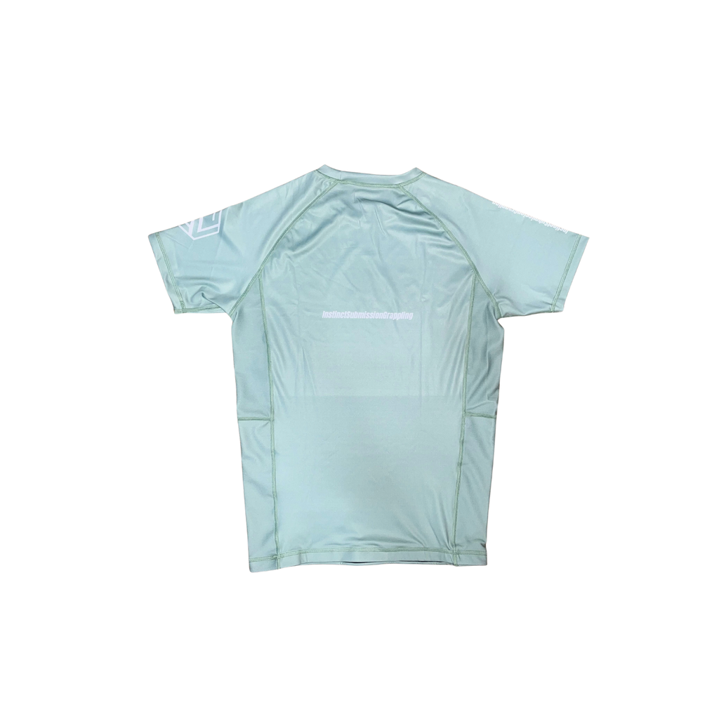 Instinct Jiu-Jitsu CORE V2 short sleeve rash guard in sage green with logo, designed for martial arts and water sports.
