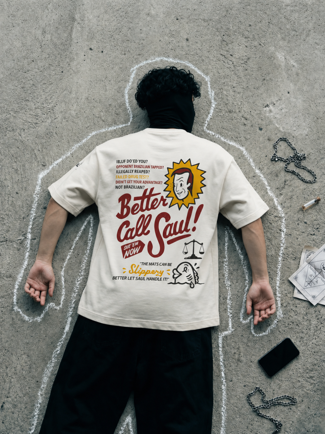 Cream Better Call Saul tee from BJJ World, back print worn inside a chalk body outline.