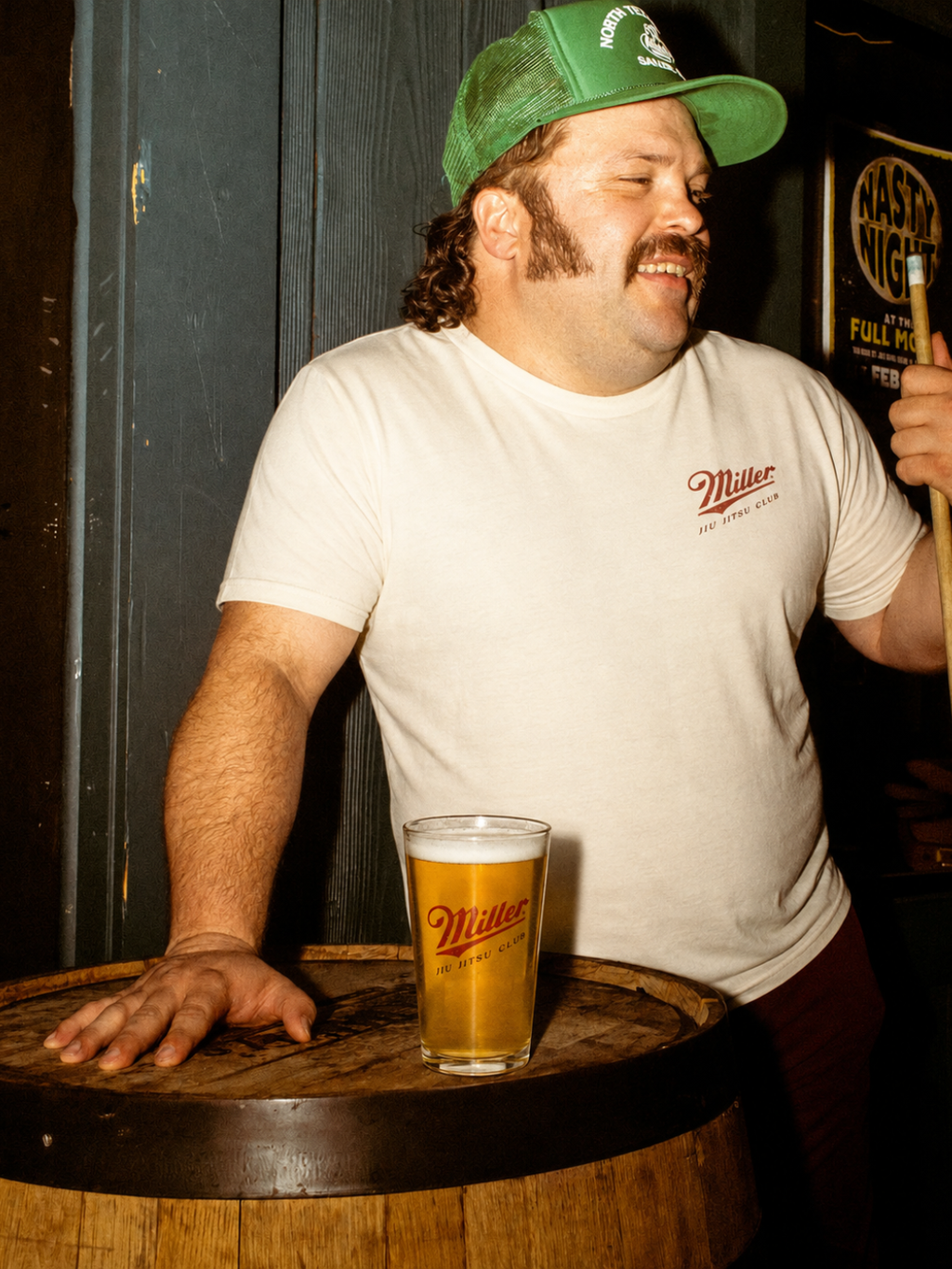 Cream Miller Jiu Jitsu Club tee from BJJ World, worn at a bar with a pint glass.